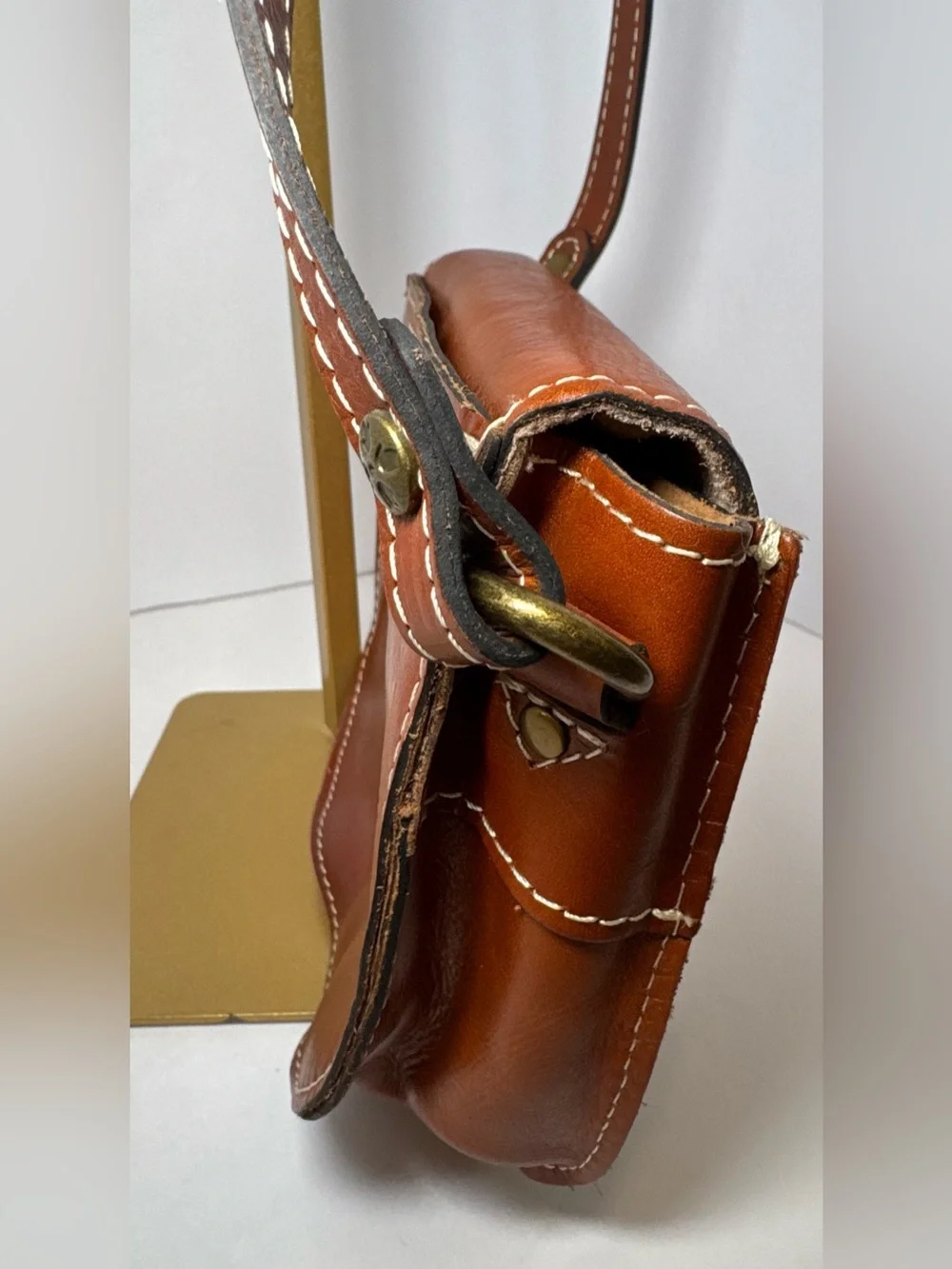 Patricia Nash Bonella Mini Crossbody Saddle Bag in their signature tan/cognac